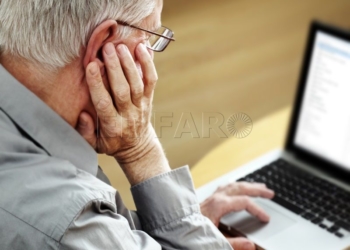 Senior with Laptop, focus on hand